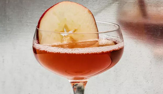 Cocktail with apple slice 