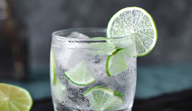 Vodka shots with ice cubes on a table