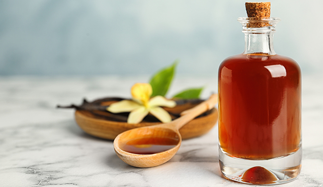 A bottle of bourbon with a spoon