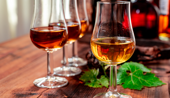A glass of cognac on a stump
