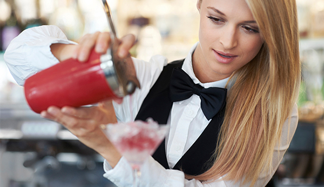 A bartender mixing a drink