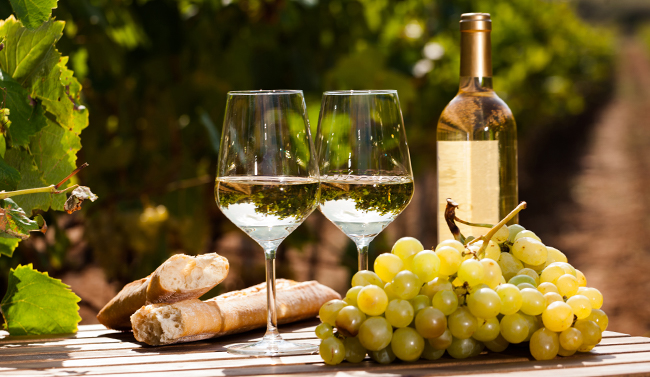 Wine and cheese on a table