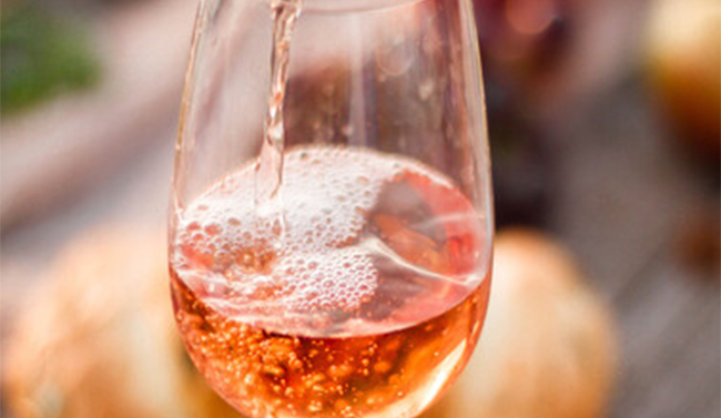 Glasses of rose lying flat on a table