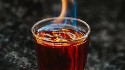 A beer and rum shot with fire