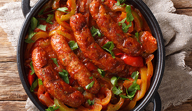 Italian sausages in a pan on a table