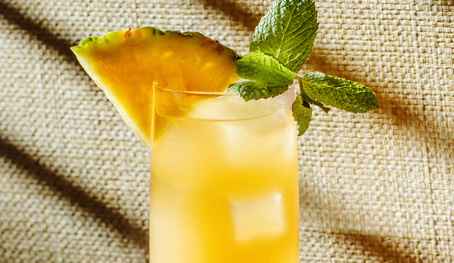 Rum cocktail with mint garnish