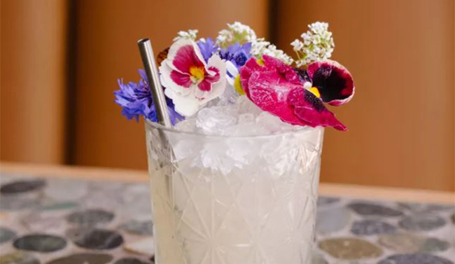 Cocktail with ice and flowers