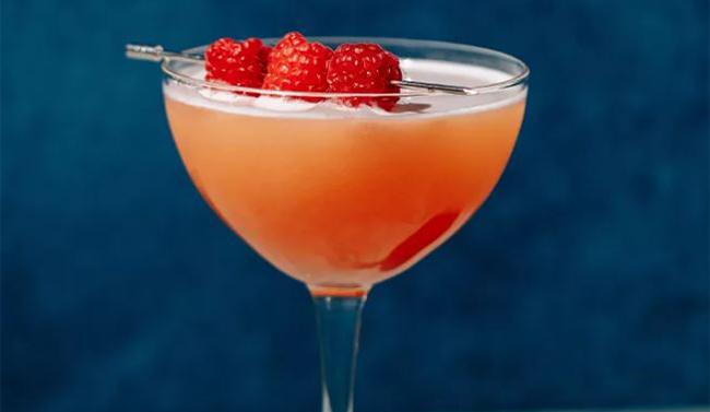 Whiskey cocktail against a light backdrop