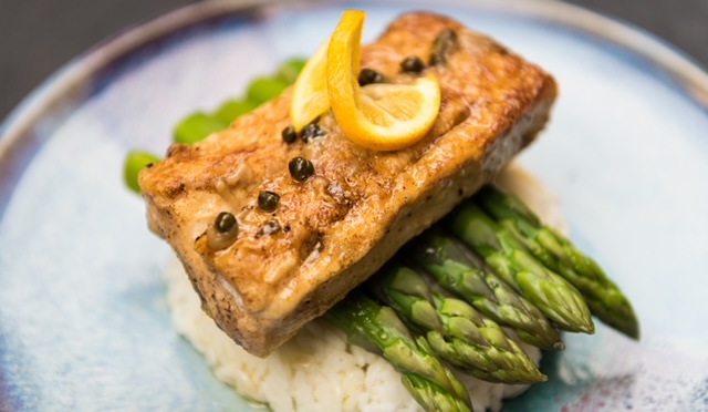 Fish with asparagus on a plate