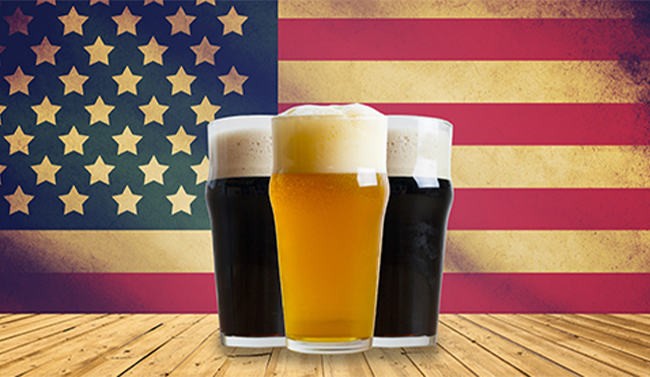 Glasses of beer against an American flag backdrop