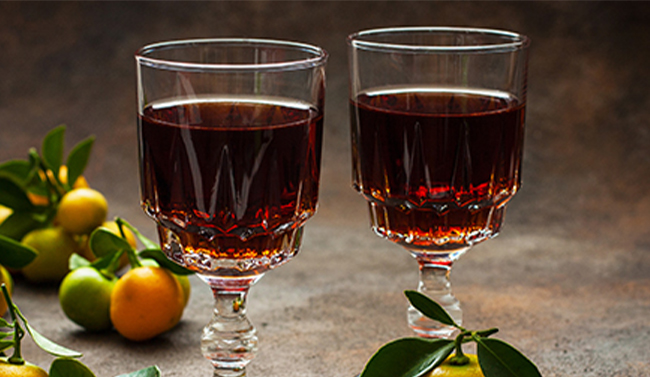 Glasses of fruit liqueurs