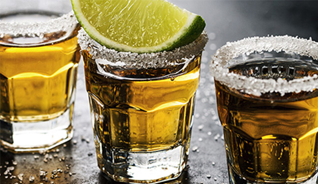 Glasses of tequila with lime
